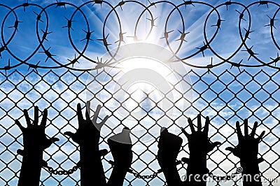 Silhouette of a crowd of hands in handcuffs Stock Photo
