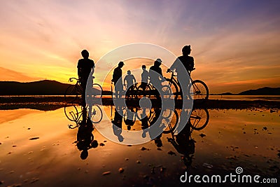 Silhouette cyclists Stock Photo