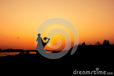 Silhouette of dad and son plan plane sunset Stock Photo