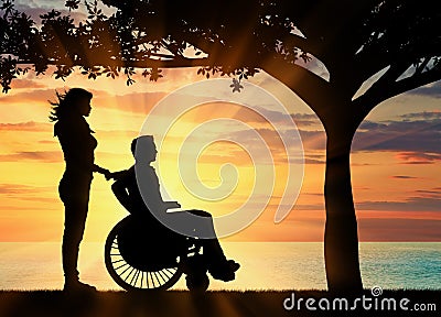 Silhouette of disabled person with a guardian Stock Photo