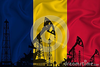 Silhouette of drilling rigs and oil derricks on the background of the flag of Romania. Oil and gas industry. The concept of oil Stock Photo