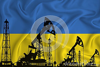 Silhouette of drilling rigs and oil derricks on the background of the flag of Ukraine. Oil and gas industry. The concept of oil Stock Photo