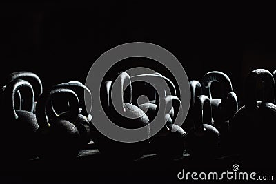 Silhouette Dumbbell for weight training in gym. Black kettlebells. 24kg. Weightlifting. Stock Photo