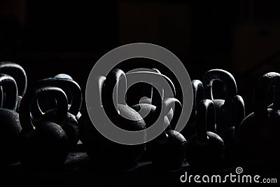 Silhouette Dumbbell for weight training in gym. Black kettlebells. 24kg. Weightlifting. Stock Photo