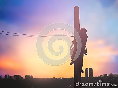 Silhouette electrical workers are installing high voltage system Stock Photo