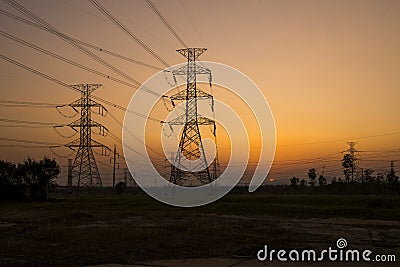 Silhouette electricity pylons Stock Photo