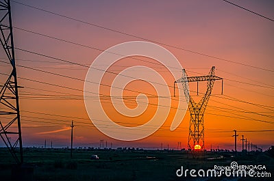 Silhouette electricity pylons Stock Photo