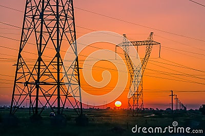 Silhouette electricity pylons Stock Photo