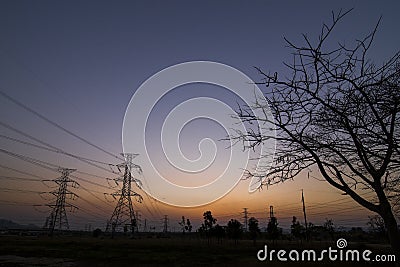 Silhouette electricity pylons Stock Photo