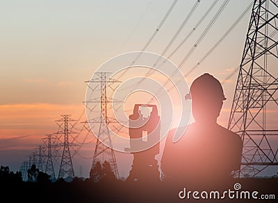 Silhouette engineer looking Loaders and trucks in a building sit Stock Photo