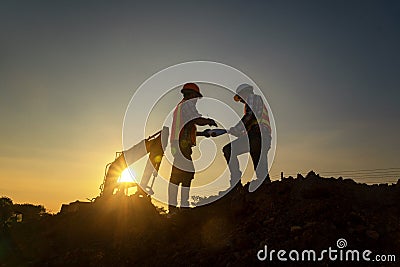 Silhouette Engineer team of the planning industry construction using the digital blueprint Editorial Stock Photo