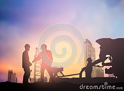 Silhouette engineer working in a building site over Blurred con Stock Photo