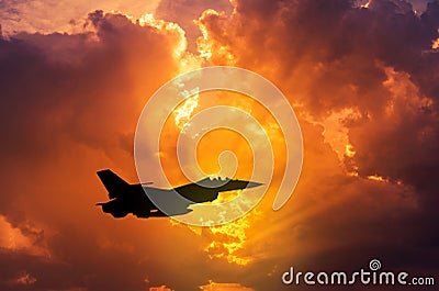 silhouette falcon fighter jet military aircraft flying on sunset Stock Photo