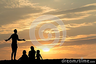 Silhouette of Family on Beach with Sunset Stock Photo