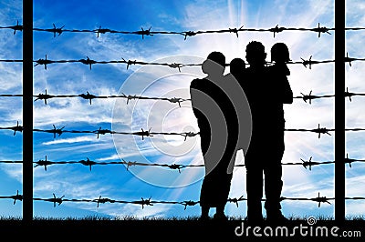 Silhouette of a family with children of refugees Stock Photo
