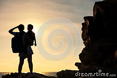 Silhouette family enjoy sunset and sea Stock Photo