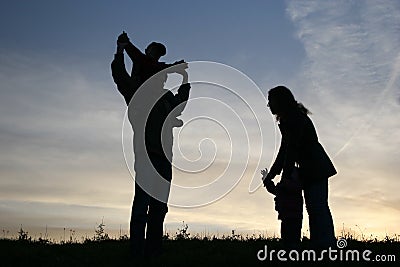 Silhouette family of four Stock Photo