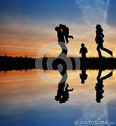 Silhouette family of four Stock Photo