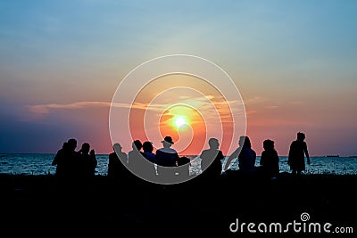 silhouette family meeting look sunset on beach Editorial Stock Photo