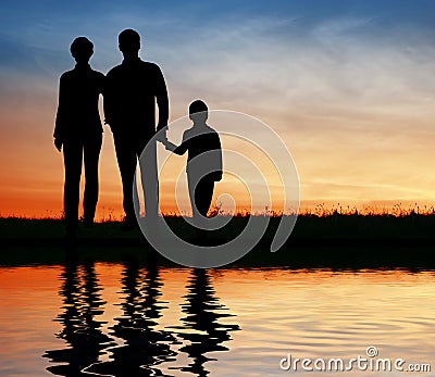 Silhouette family on sunset Stock Photo