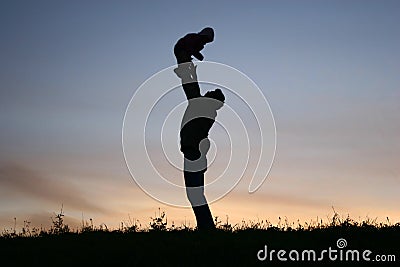 Silhouette father with baby Stock Photo