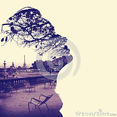 Silhouette of a female head profile, framing Paris Eiffel Tower Stock Photo