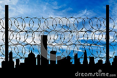 Silhouette of fence and cities away Stock Photo