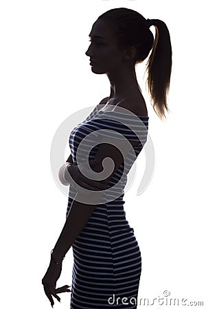 silhouette of figure of female on a white isolated background, profile of a beautiful young woman Stock Photo