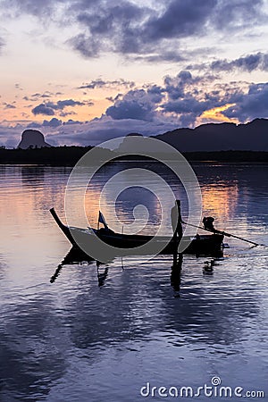 Silhouette fisherman in fishing boat on sea Editorial Stock Photo