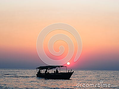 Silhouette of Fishermans boat on Lake Tanganyika Stock Photo