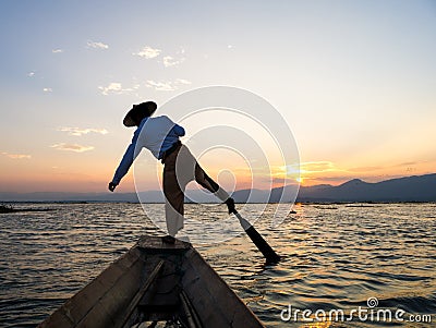 Silhouette fishermen in Inle Lake at sunrise, Shan State, Myanmar Stock Photo