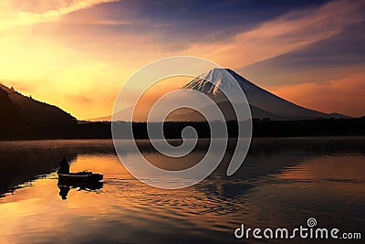 Silhouette fishing boat and Mt. Fuji at Shoji lake Stock Photo