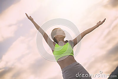 Silhouette fitness woman exercising at sunset time Stock Photo
