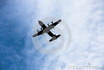 Silhouette four engine propeller airplane on sky Stock Photo