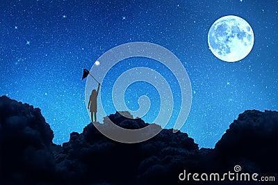 Silhouette of a girl standing on a cloud catches Stock Photo