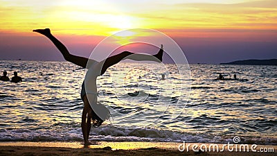 Silhouette Of A Girl At Sunset Against The Background Of The Sea Slender Leggy Girl Funny Doing Gymnastic Coups On The Stock Video Video Of Summertime Girl