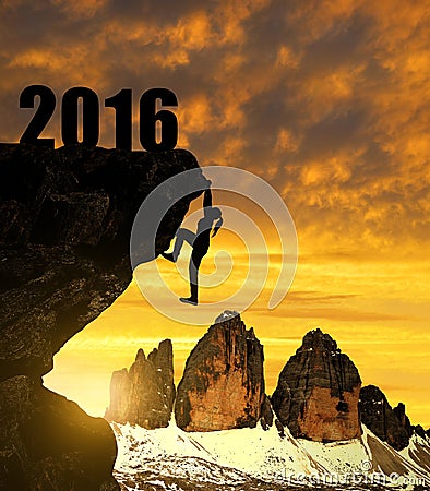 Silhouette girls climbs into the New Year 2016. Stock Photo