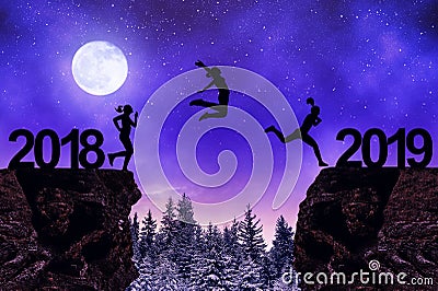 Girls jump to the New Year 2019 in night. Stock Photo