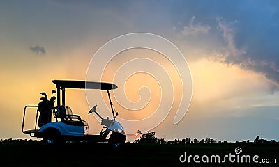 Silhouette golf cart in golf course with colorful twilight sky background Stock Photo