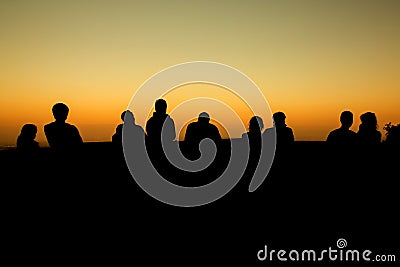 silhouette of group of friends standing Stock Photo