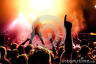 Silhouette of guitar player in action on stage Stock Photo