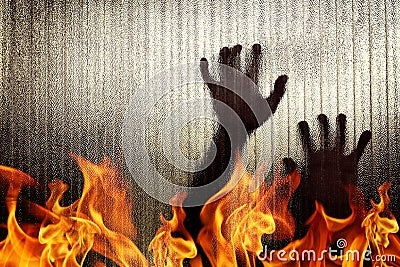 Silhouette of a hand the expression to need help with blaze fire flame Stock Photo