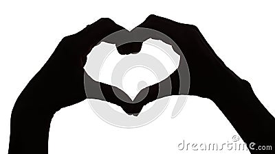 Silhouette hand in heart shape. Stock Photo