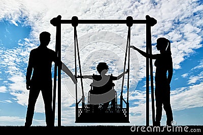 Silhouette of a happy child is a disabled person in a wheelchair on an adaptive swing Stock Photo