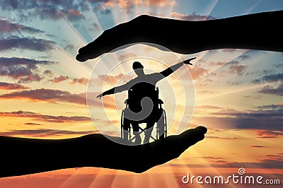 Silhouette of happy disabled man in wheelchair in hands of help Stock Photo