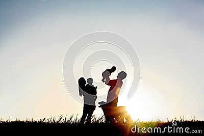 Silhouette of Happy Family and Dog Stock Photo