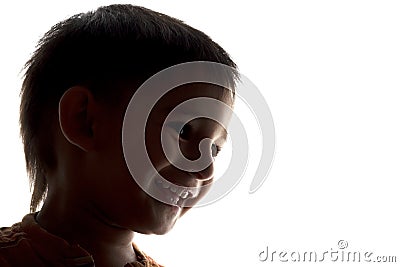 Silhouette of happy laughing child face Stock Photo