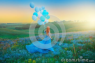 Silhouette happy woman. Fantasy girl princess holding in hand ball air balloon. long blue tulle dress fluttering fly in Stock Photo