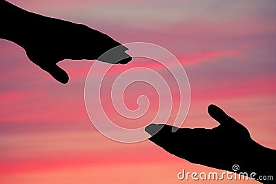 silhouette of helping hand . Stock Photo