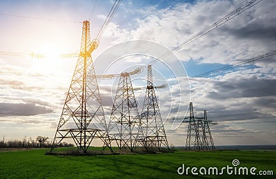 Silhouette High voltage electric towers. High-voltage power lines. Electricity distribution station Stock Photo